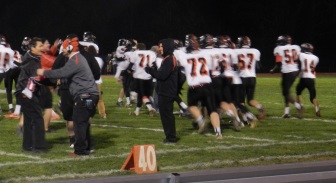 Saucon players rush the field at Southern Lehigh School District Stadium as the clock ticks down to zero.