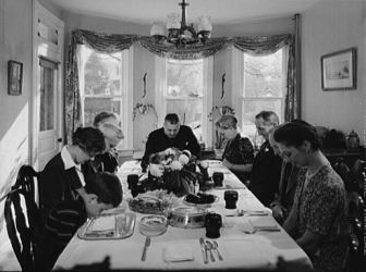 An American family says grace before Thanksgiving dinner in Neffsville, Pa., in 1942.