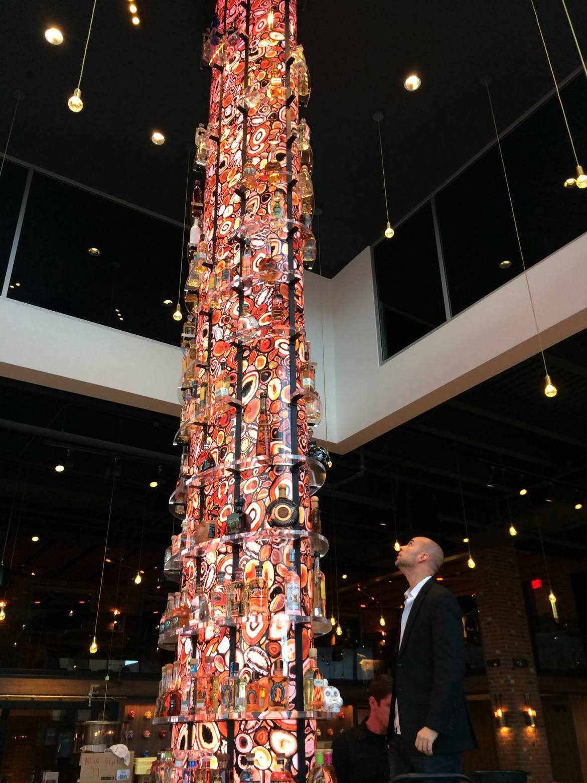 The final touches are put on a three-story tequila tower at the new modern Mexican restaurant Torre at The Promenade Shops at Saucon Valley in Upper Saucon Township.