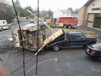 A Facebook photo shows a garbage truck on its side in front of the Leithsville fire station on Rt. 412 in Lower Saucon Township on Dec. 2, 2014.