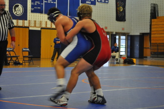 Giving up 10 pounds to Wyatt Noone of Southern Lehigh, Nate Kehs of Saucon Valley works for a takedown.