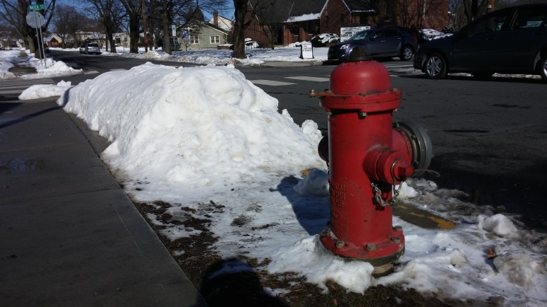 Snow is cleared from around a fire hydrant in front of the post office on Delaware Avenue in Hellertown.