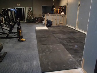 Rubber flooring which will be more sanitary is installed at the Main Street Gym in Hellertown.