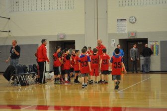 Saucon Valley Youth Basketball parent-volunteer Reggie Robertson gets ready to deliver his pregame pep talk.