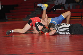 Saucon's Dylan Yonney gathers back points on his way to a major decision.