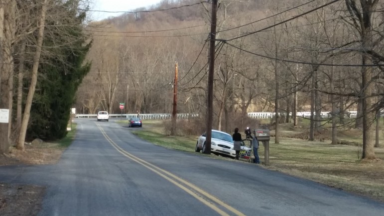 A Channel 69 WFMZ-TV News crew is parked along Apple Street in Lower Saucon Township, near the scene of a brush fire where a man was found dead Monday.