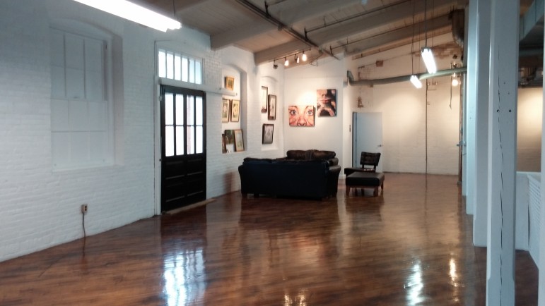 Refinished wood floors gleam and reflect the freshly painted white brick walls inside The Art Establishment in Fountain Hill. The studio for amateur artists is housed in a former textile mill on Broadway.