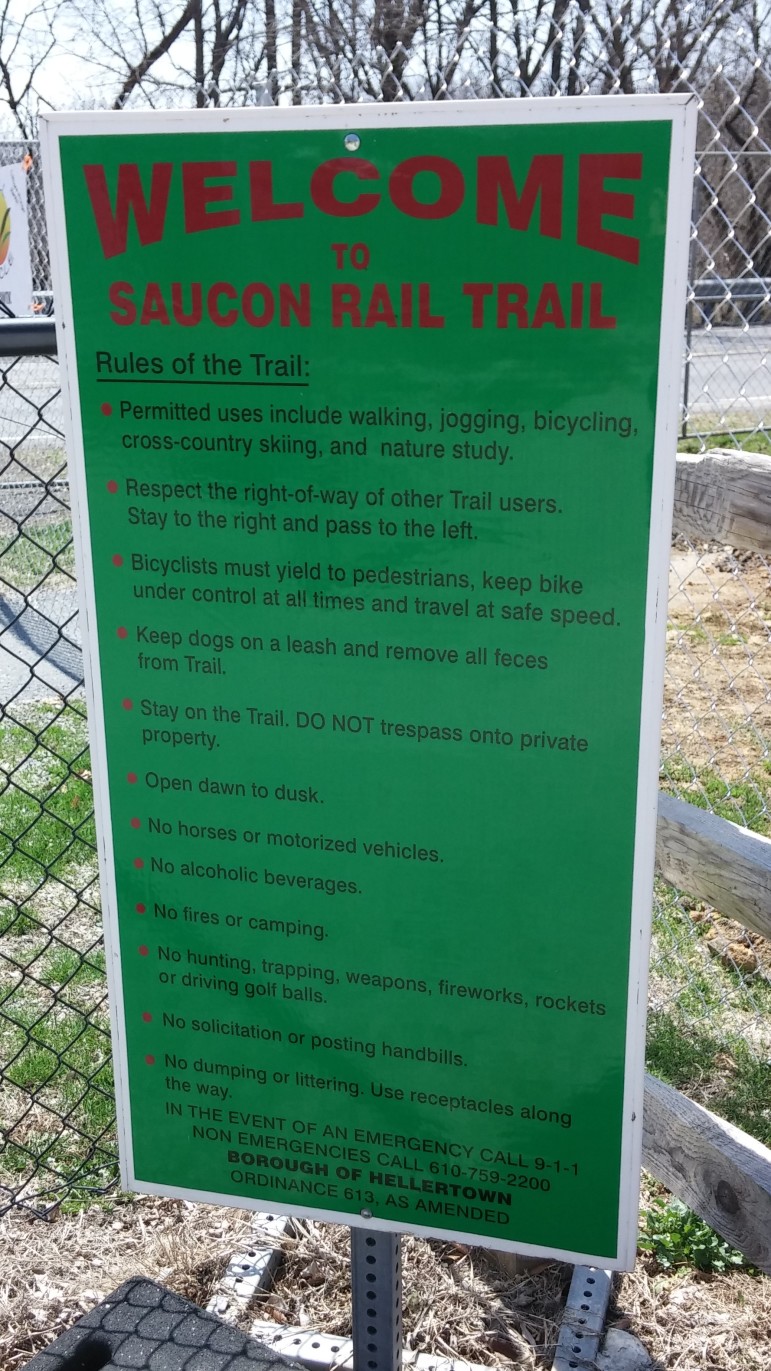 A sign along the Saucon Rail Trail at Water Street Park in Hellertown outlines the rules for trail users.