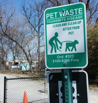 A sign along the Saucon Rail Trail in Hellertown reminds dog-walkers that it is not only proper etiquette to clean up after their pooches--it is also the law.