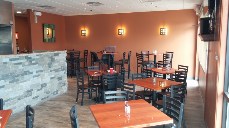 The Art Cafe at 3610 Rt. 378, Bethlehem, features a cozy, earth-toned interior with both traditional table and high-top table seating.