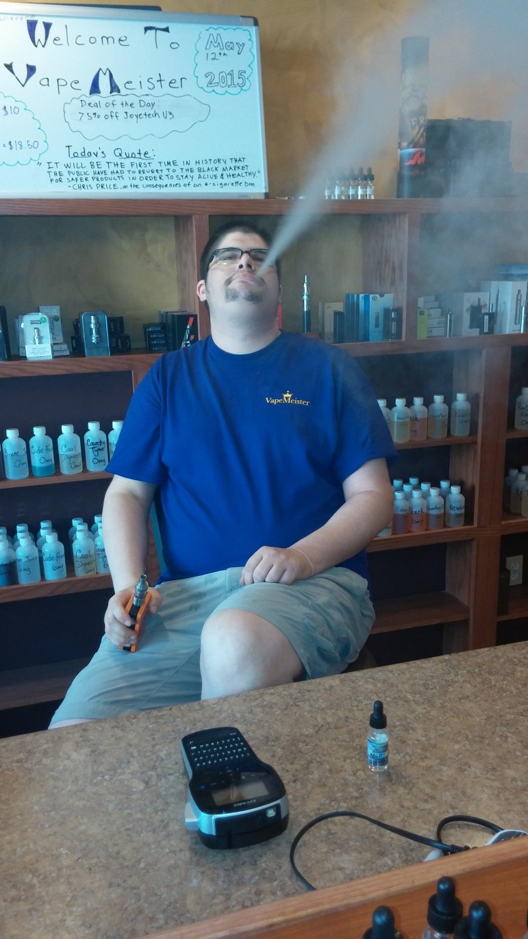 VapeMeister Hellertown manager Jeremy Onorato vapes inside the store at 630 Main Street. Onorato, who lives in Lopatcong Township, N.J., said he's been vaping for about eight years.