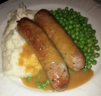 Bangers and mash is a traditional Scottish sausage served with mashed potatoes, onion gravy and peas. It's listed under Scottish Fare on the Braveheart ordering app.