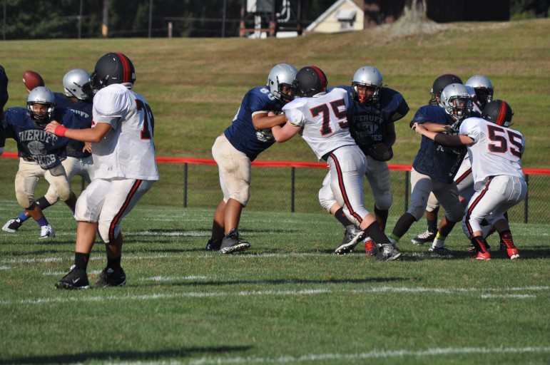 Panther eighth grader, Jake Bruchak, bringing his pass rush against a Dieruff double teamin the junior-high scrimmage
