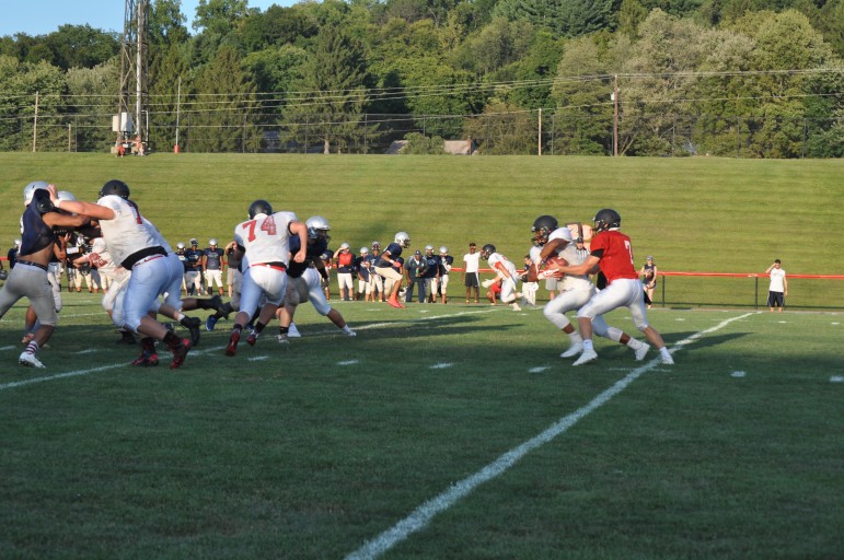 Zach Thatcher hands off to Evan Culver as the Panther "Hogs" control the line of scrimmage