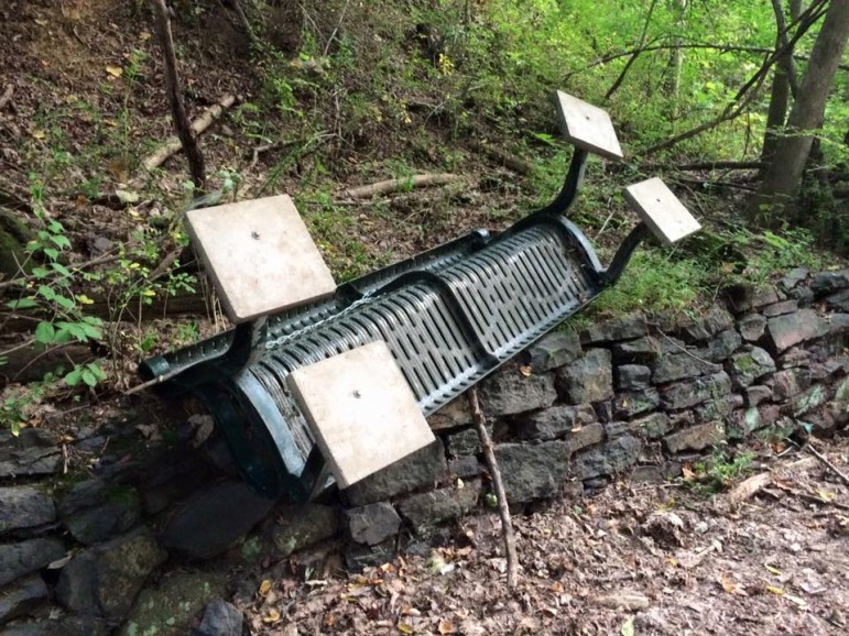 A bench along the Saucon Rail Trail near the Reading Drive trailhead in Lower Saucon Township was overturned by vandals on Sept. 4, 2015.