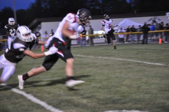 Mike Kane shakes off a tackle on the way to the endzone