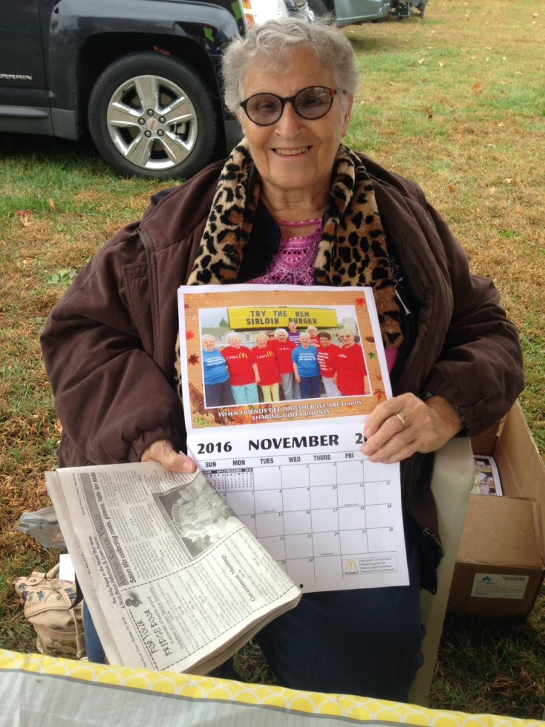 Phyllis Amelio displays a calendar at the Saucon Valley Farmers' Market.