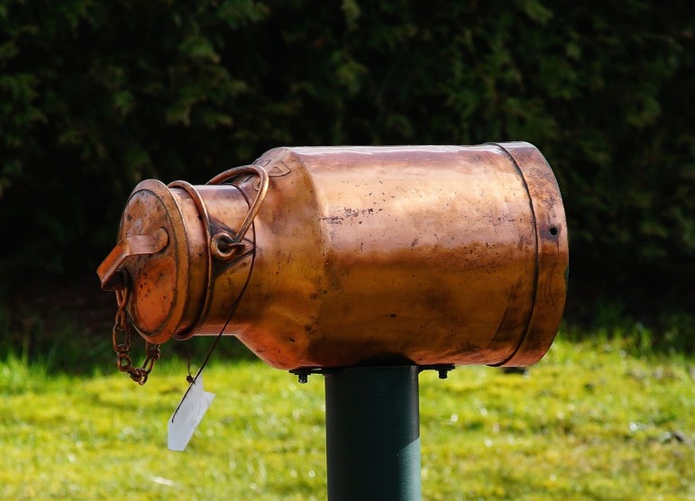 A copper milk can converted into a mailbox