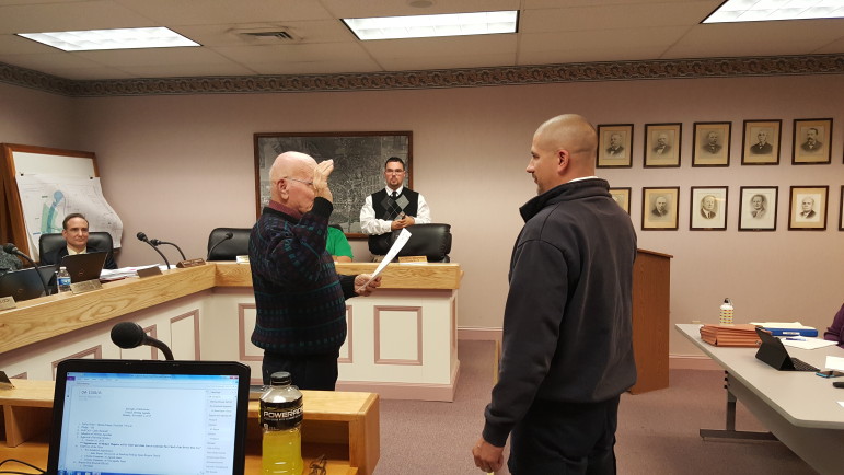 Mike Maguire is administered the oath of office by Hellertown Mayor Richard Fluck after being elected Dewey Fire Co. chief.