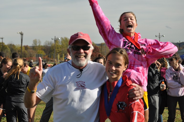 Coack Kolosky and Kiele being photo bombed by Northwestern Lehigh's freshman Maddie Consuelos at the District XI championships