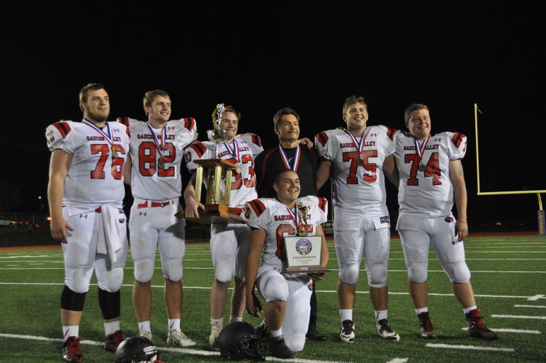 The 2015 Hogs holding the hardware and looking for more!