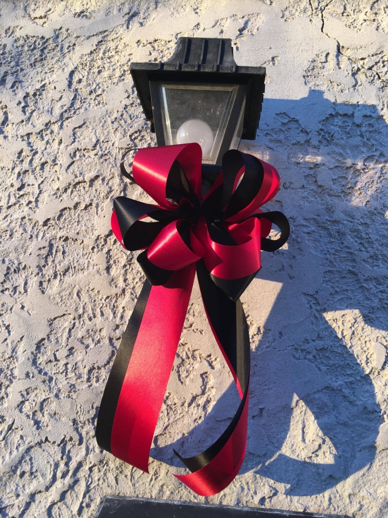 An example of one of the bows, which are suitable for outdoor display because they are made with weatherproof ribbon.