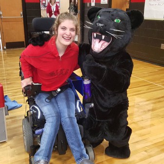 Saucon Valley student Carli Ziegler poses for a photo with the Panther at Thursday's pep rally.