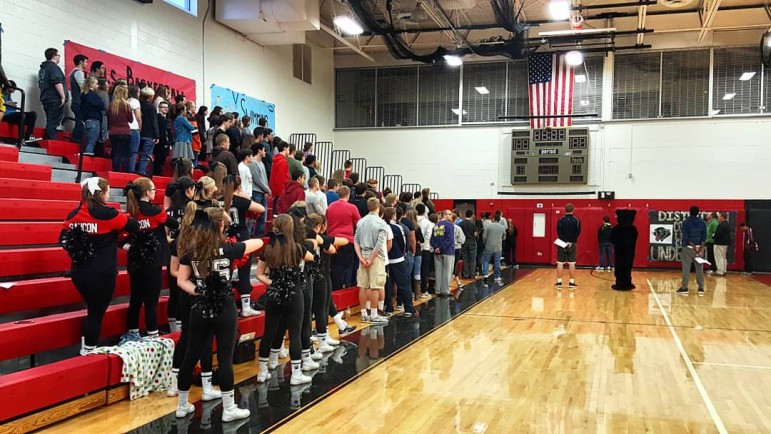 Saucon Valley High School students, faculty and staff stand as the Star-Spangled Banner is performed at Thursday's pep rally.