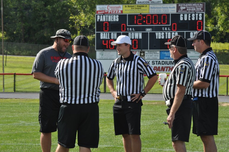 Saucon Valley head coach Matt Evancho explains format to referees during a 2015 pre-season football scrimmage (FILE PHOTO).