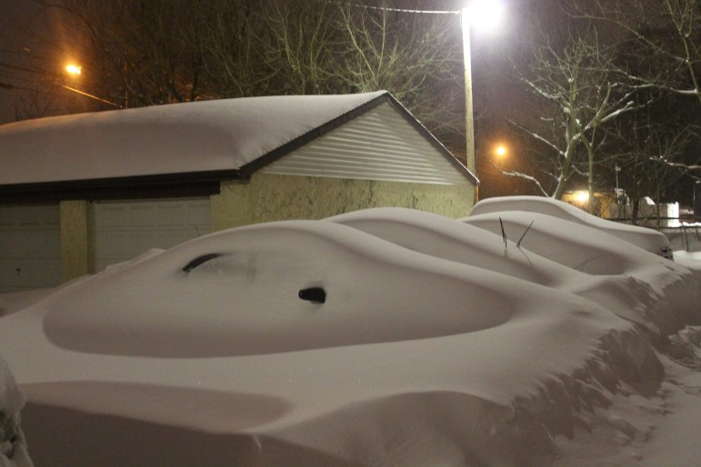 Cars became white "lumps" thanks to the blizzard.