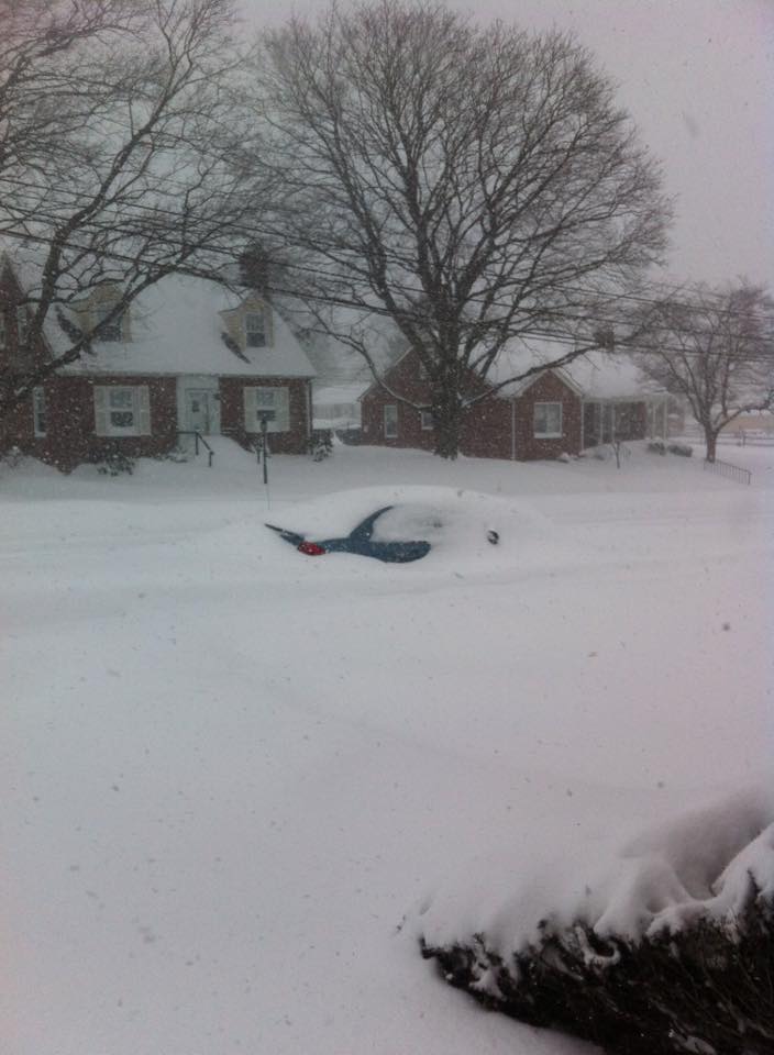 A car is nearly buried on First Avenue in Hellertown