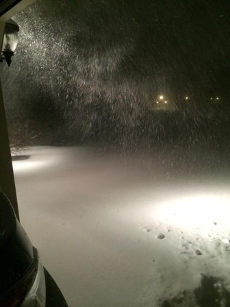 Heavy snow falls at a home off Meadows Road in Lower Saucon Township at around 4 a.m. Saturday