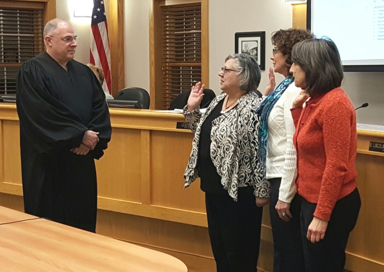 Lower Saucon Township District Judge David W. Tidd swears in councilwomen Priscilla deLeon, Donna Louder and Sandra Yerger on Monday, Jan. 4, 2016.