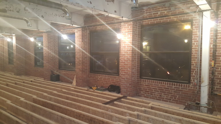 The main seating area will be located along the building's north wall, which is lined with large windows.