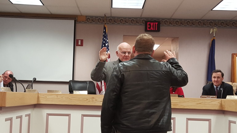 John Bate is sworn in as a Hellertown borough council member by mayor Richard Fluck.