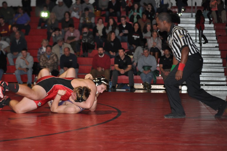 Trey Polak with a first period pin against league rival Palisades
