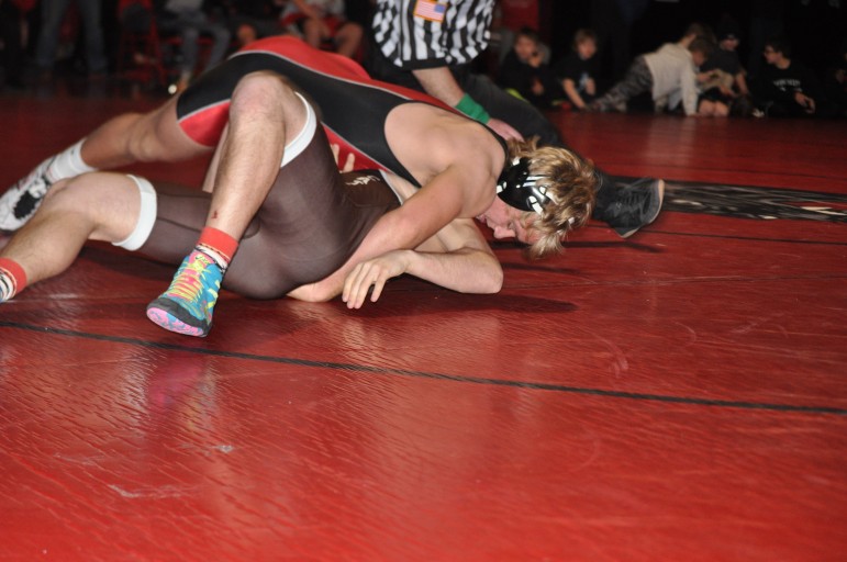 Saucon valley Nate Kehs (170) picks up a pin for the Panthers