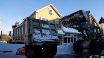 Crews work to remove a large amount of snow from the 600 block of Main Street (Rt. 412) in downtown Hellertown Monday. The effort has continued unabated since the Blizzard of 2016 dumped approximately 30 inches of snow on the area on Saturday.