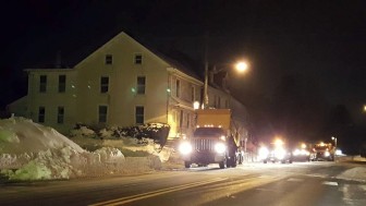 Snow removal operations continued late into Monday evening along Main Street in Hellertown. Pictured, heavy equipment removes snow from the street near Magnolia Road and Main Street.