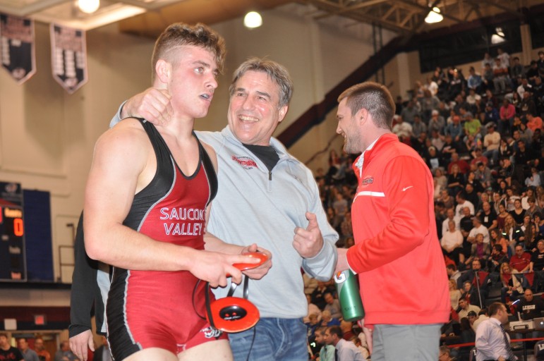 Nate Harka is congratulated by Coach Rohn