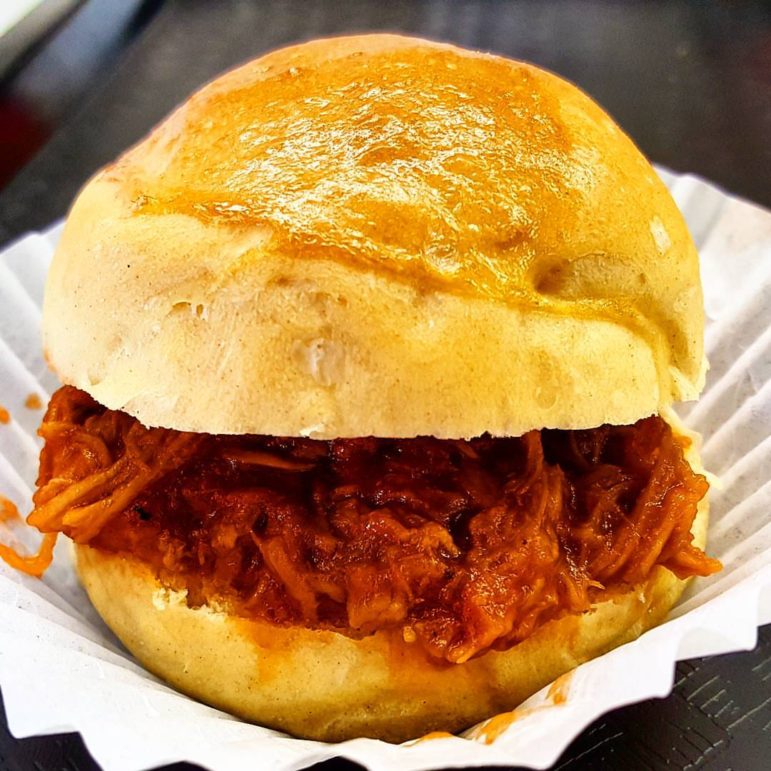 A pulled pork sandwich made by the Culinary Experience Catering using a Hellertown Bakery fresh roll.