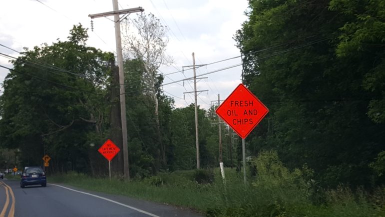 Oil and chip signs are posted along Friedensville Road in Lower Saucon Township on June 6, 2016.
