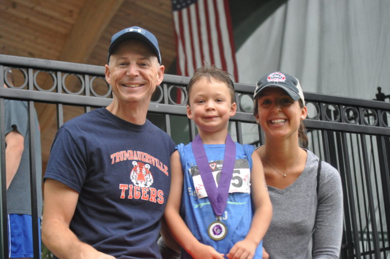 Tyler Hollohan shares a winning moment with his Mom and Dad.