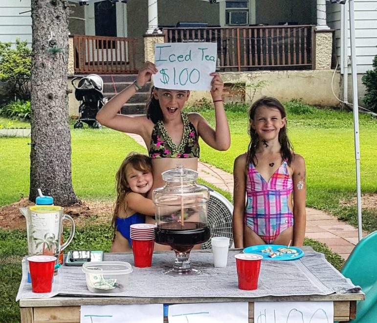 Abbie, Ava and Bri were raising money by selling iced tea so they would have spending money for the Dewey Fire Co. Carnival Friday.