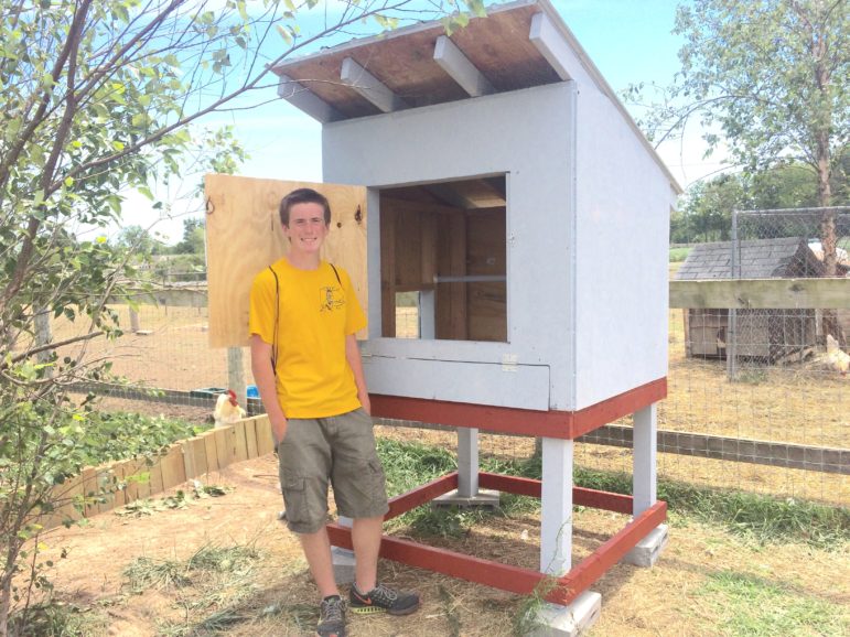 Ben Szydlow stands with the rooster coop he constructed as an Eagle Scout project at Last Chance Ranch Animal Rescue in Quakertown.