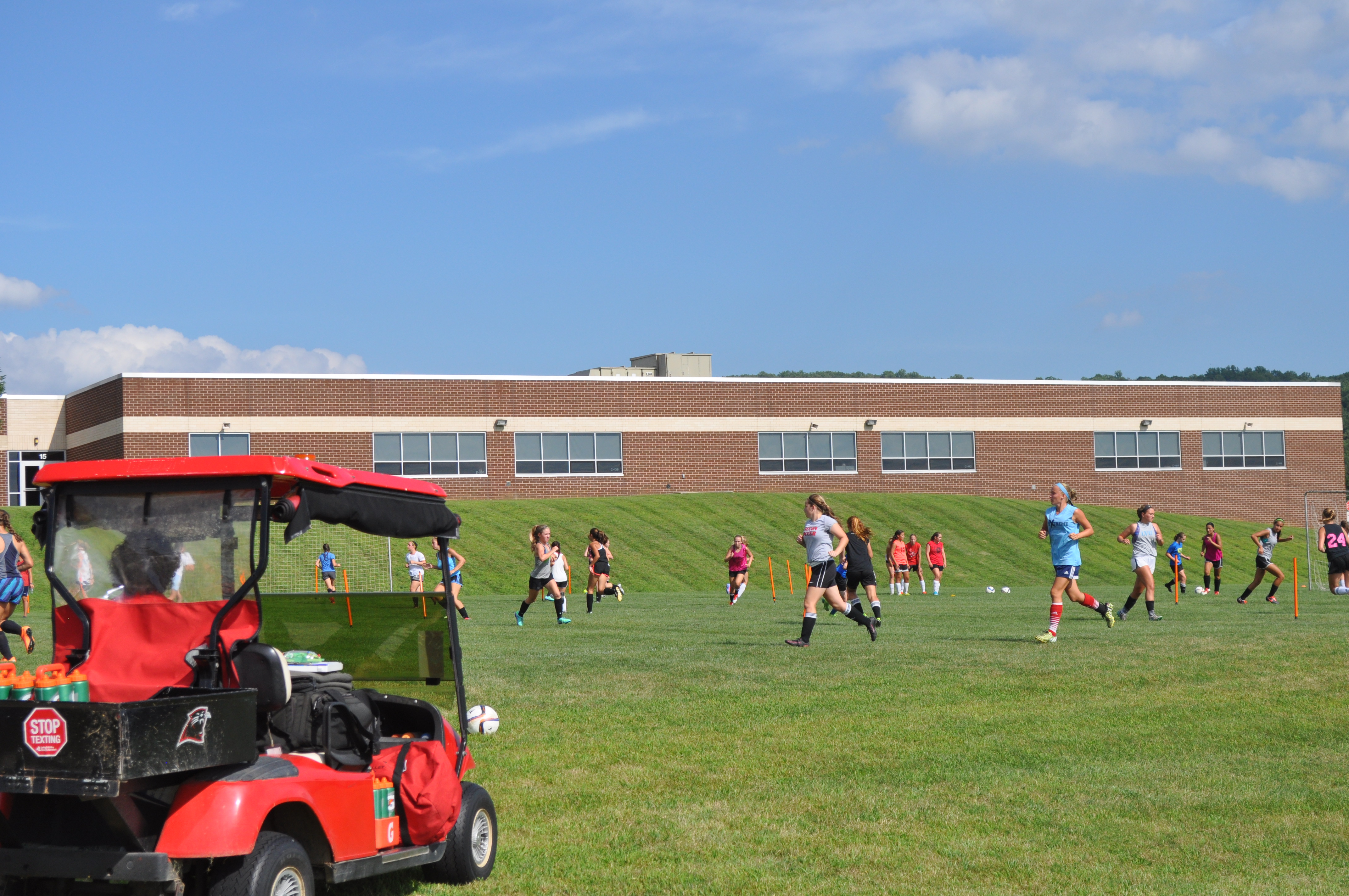 Girls Soccer under the watchful eye of Trainer Amy working hard.