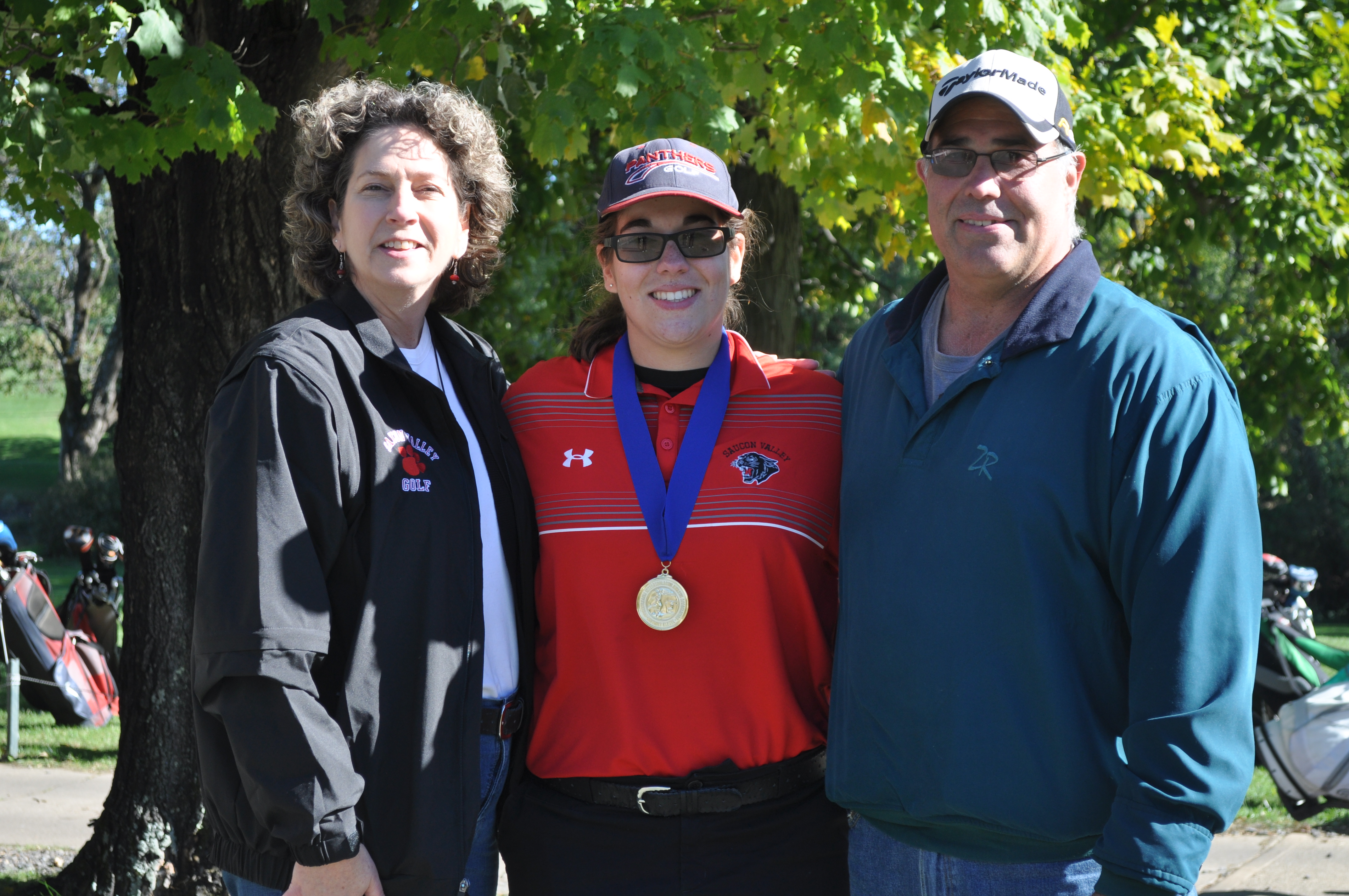 2016 District XI Champion Sophia Israel with her Mom and Dad.