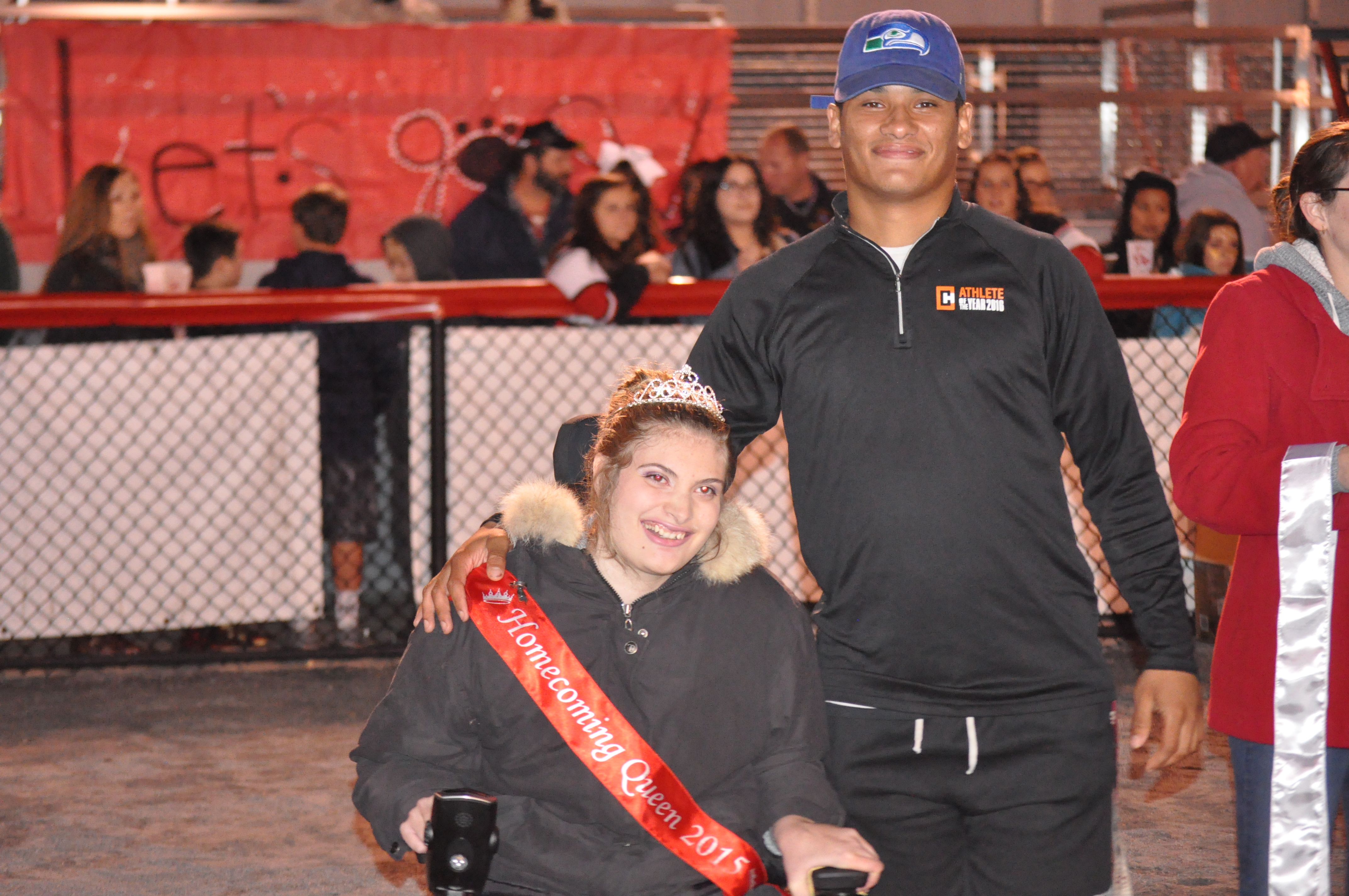 2015 Homecoming Queen and her escort Evan Culver returned to pass the crown.