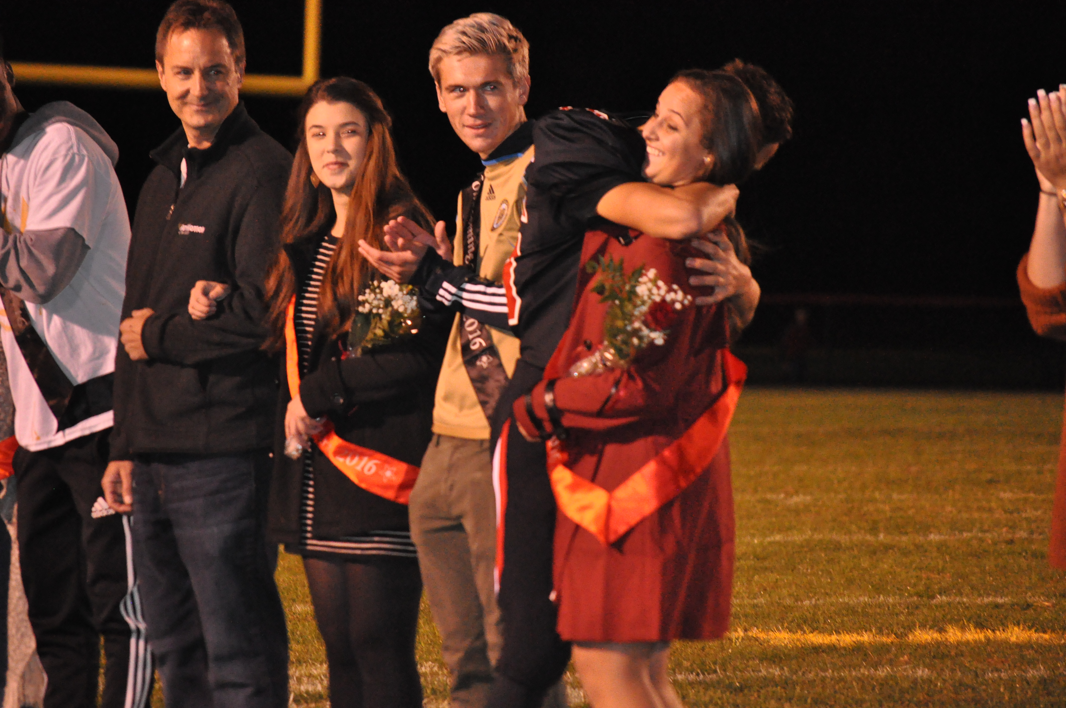 2016 Homecoming Queen Madison Stump gets a big hug from her brother/escort C.J.