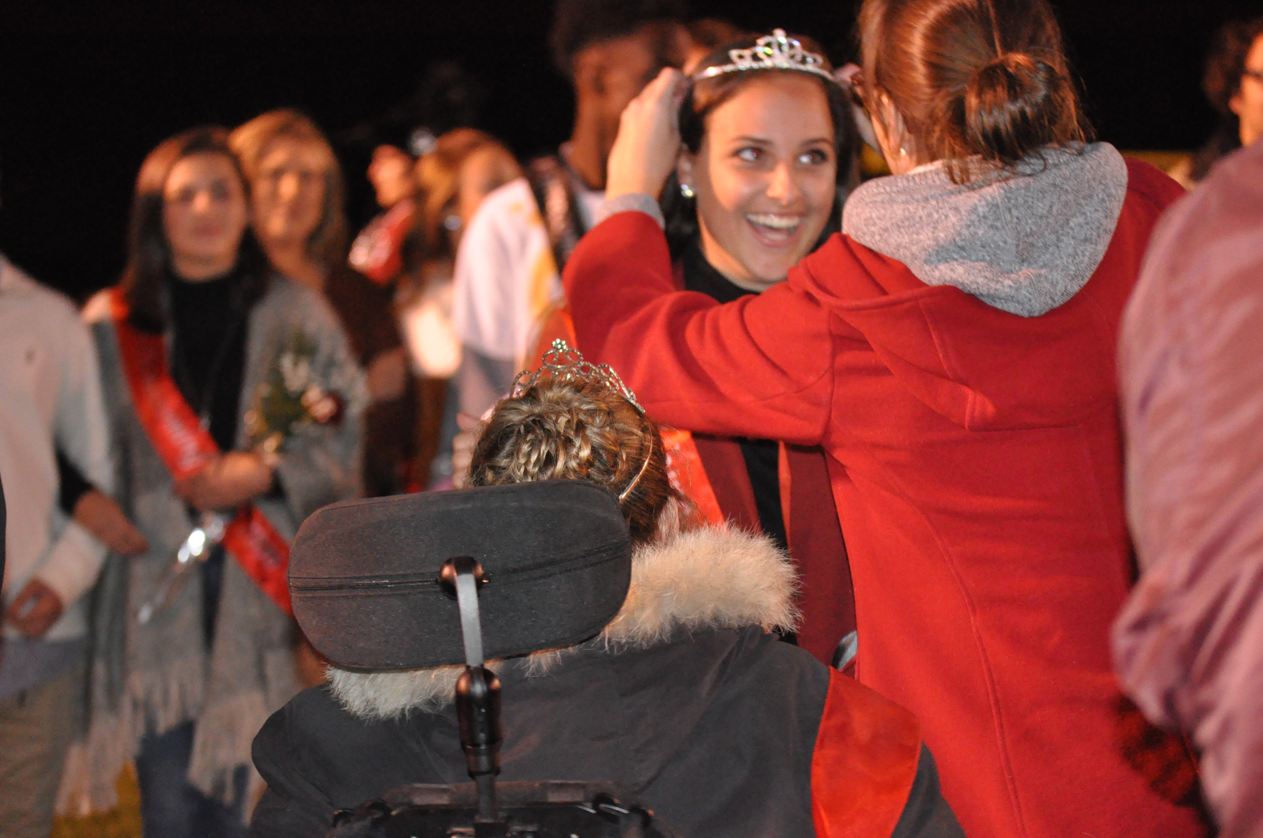 2015 Homecoming Queen Carli Ziegler returns to crown Madison Stump.